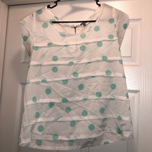 White blouse with teal polka dots blouse.